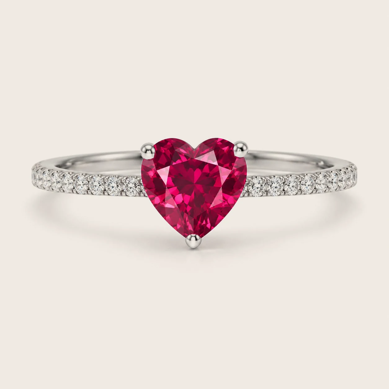 A heart cut centre stone in three prongs on a paved band
